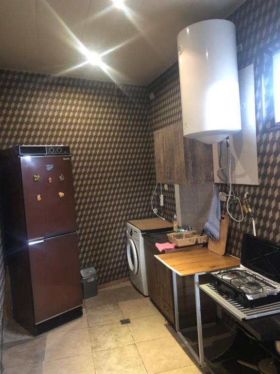 Kuchyň nebo kuchyňský kout v ubytování Apartment Zaziashvili 30
