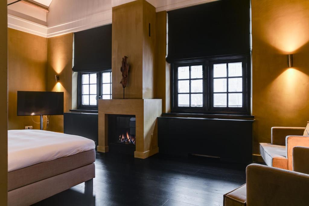 Postel nebo postele na pokoji v ubytování Vesting Hotel Naarden