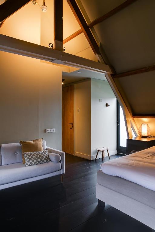 Postel nebo postele na pokoji v ubytování Vesting Hotel Naarden