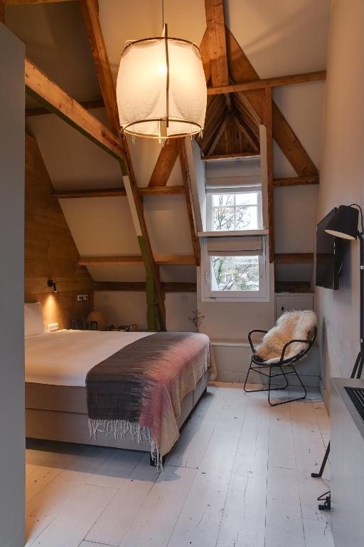 Postel nebo postele na pokoji v ubytování Vesting Hotel Naarden