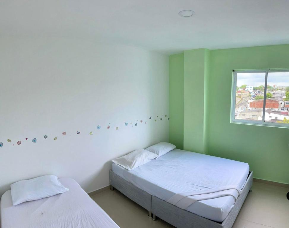 Posteľ alebo postele v izbe v ubytovaní Apartamento 405