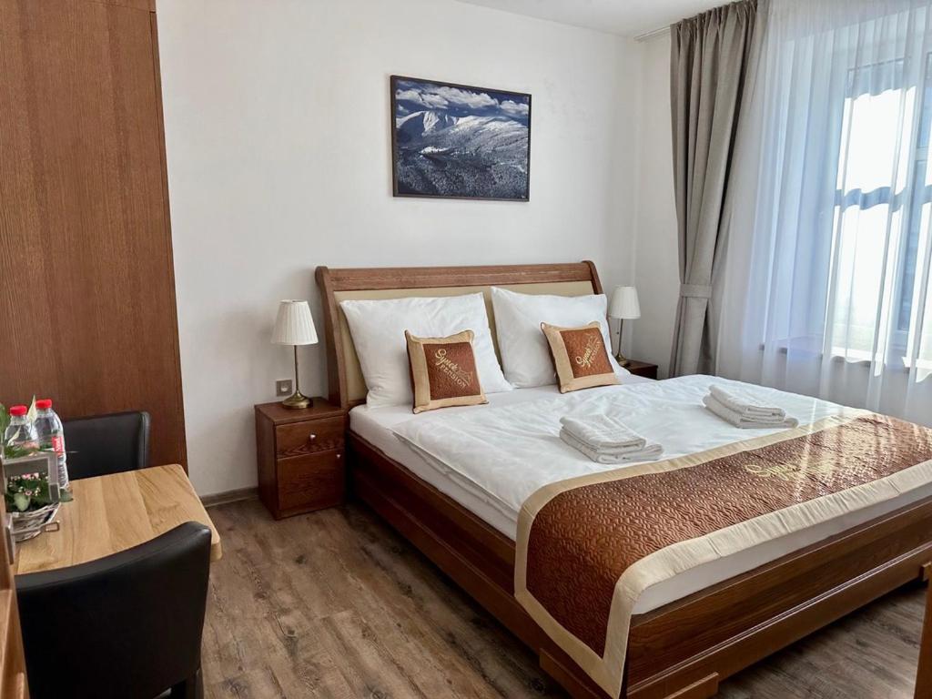 Postel nebo postele na pokoji v ubytování SYNEK Pension