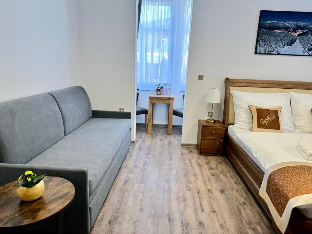 Postel nebo postele na pokoji v ubytování SYNEK Pension