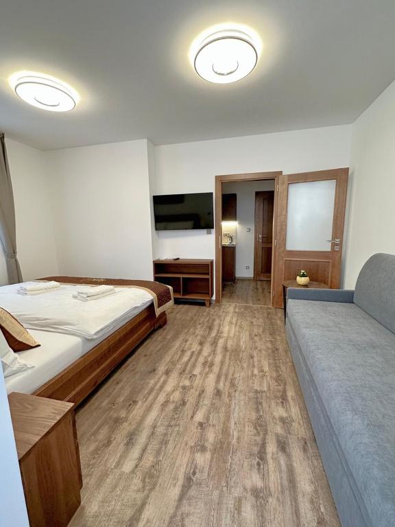 Postel nebo postele na pokoji v ubytování SYNEK Pension
