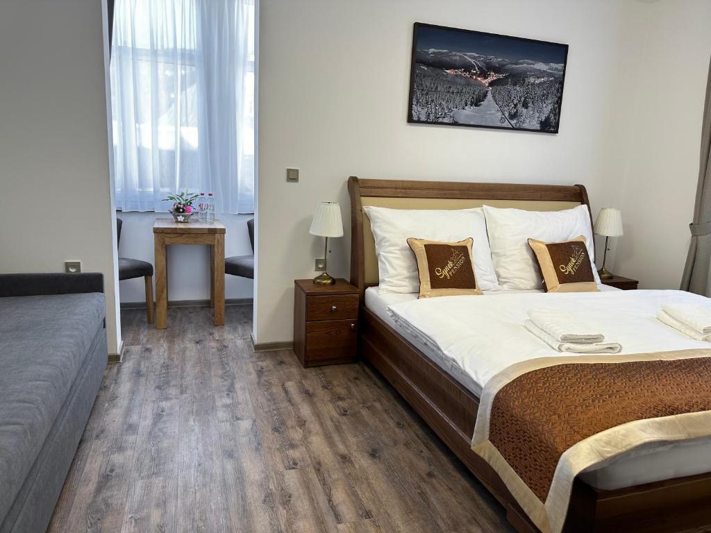 Postel nebo postele na pokoji v ubytování SYNEK Pension