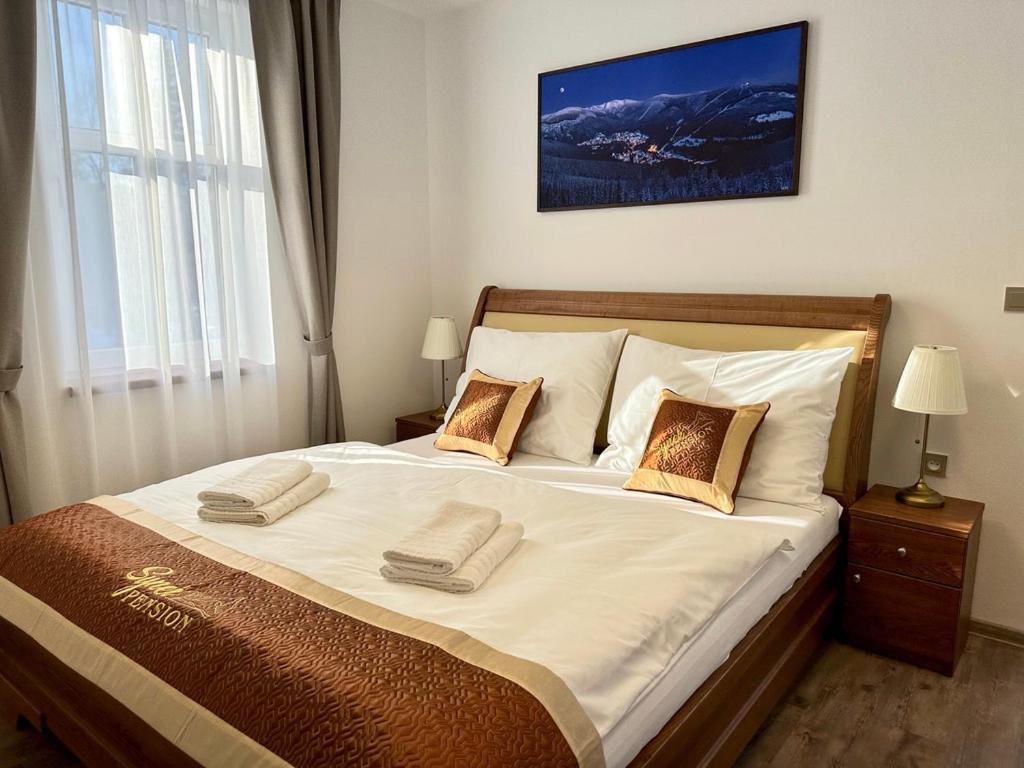 Postel nebo postele na pokoji v ubytování SYNEK Pension