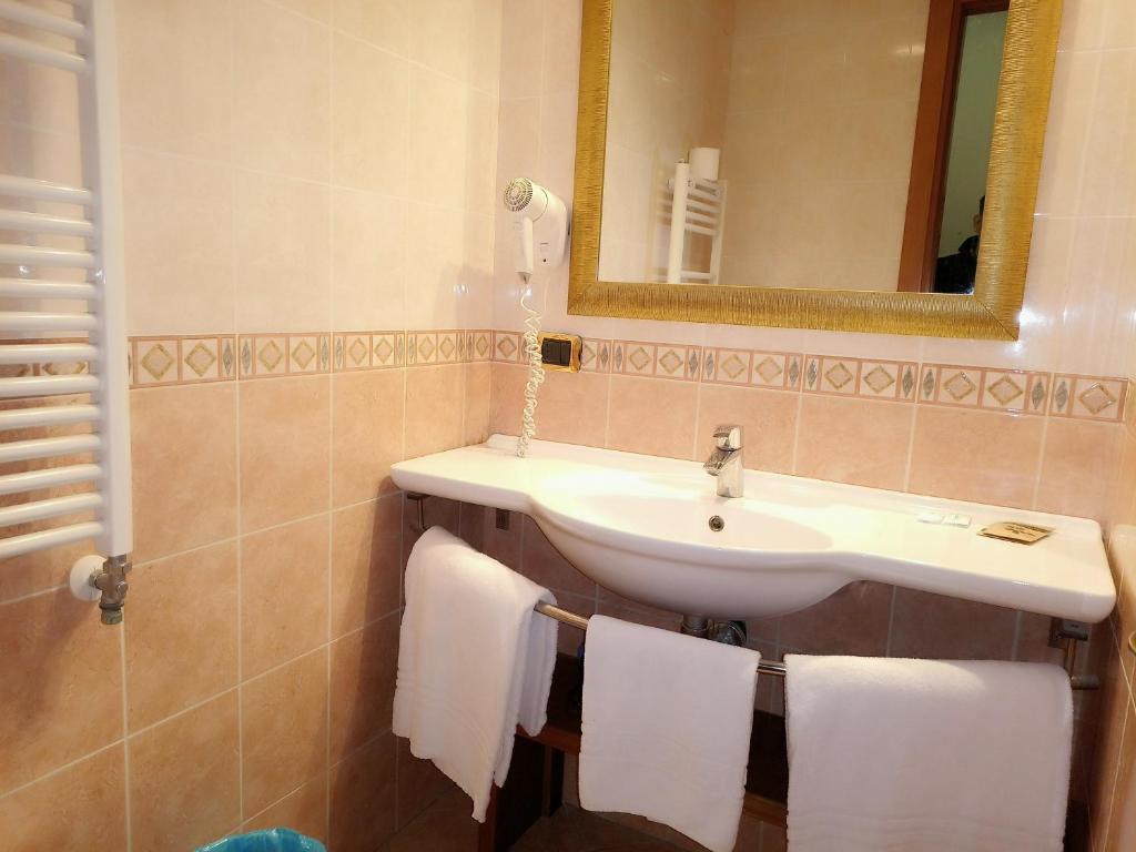 Koupelna v ubytování Hotel Positano