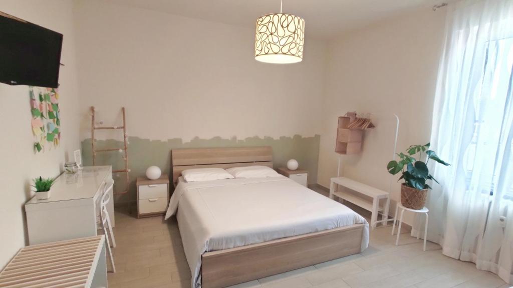 Postel nebo postele na pokoji v ubytování B&B Le Albarelle