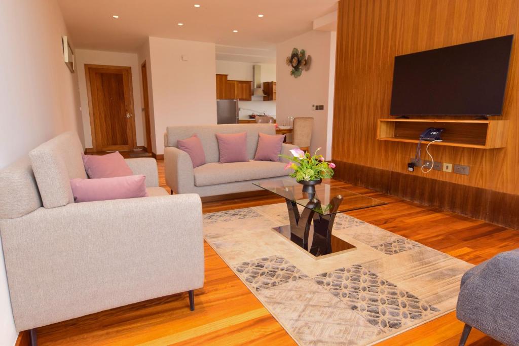 TV a/nebo společenská místnost v ubytování Broadwalk Residency
