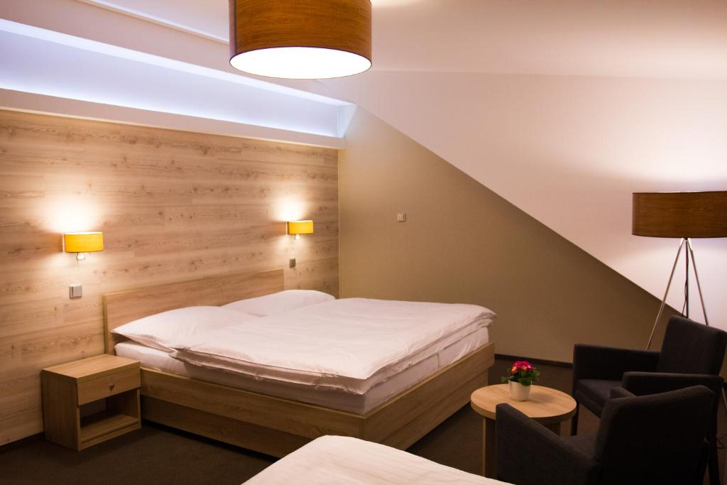 Postel nebo postele na pokoji v ubytování Hotel Freud