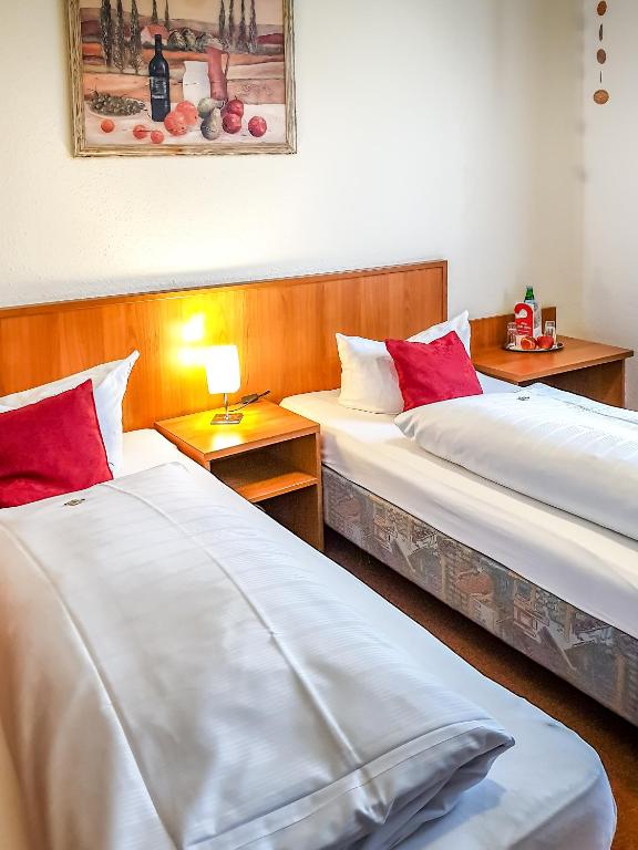 Postel nebo postele na pokoji v ubytování Guesthouse Beckmann