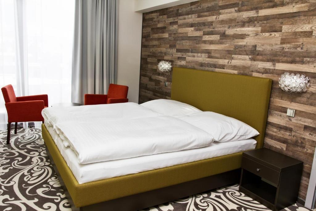 Postel nebo postele na pokoji v ubytování Hotel Freud