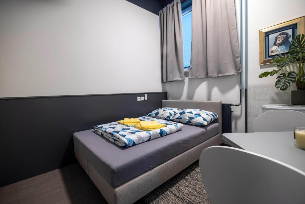 Postel nebo postele na pokoji v ubytování Hostel Limaks Celje