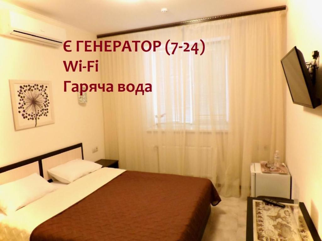 Postel nebo postele na pokoji v ubytování Breeze Hotel