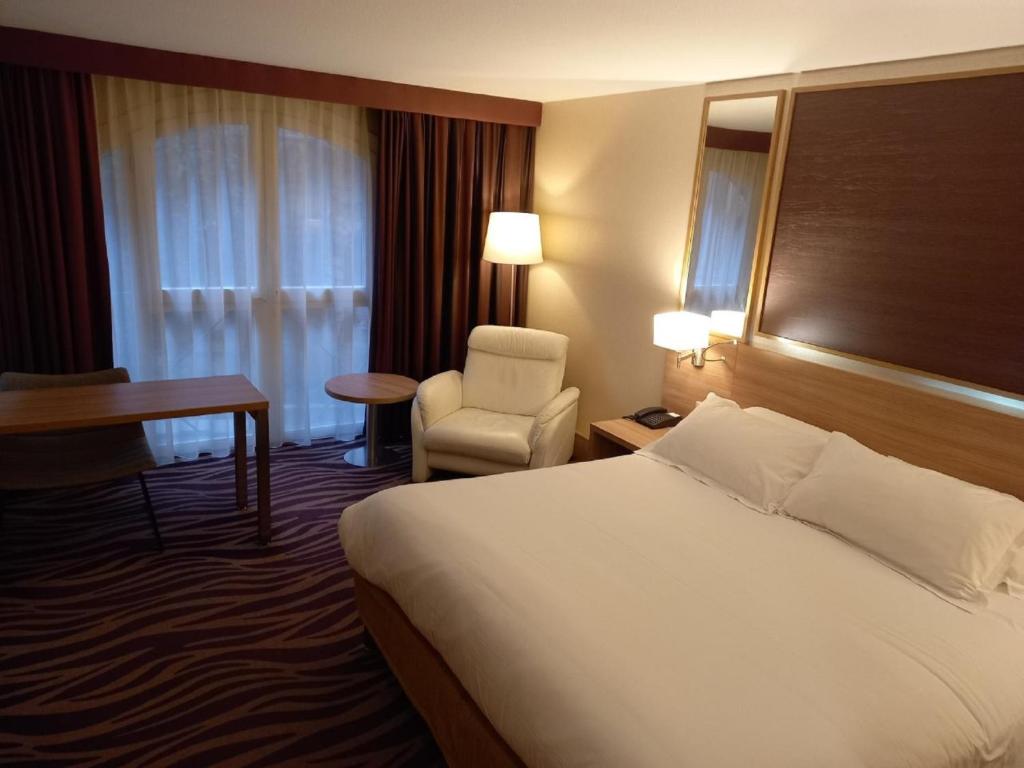 Postel nebo postele na pokoji v ubytování Plaza Hotel Capitole Toulouse