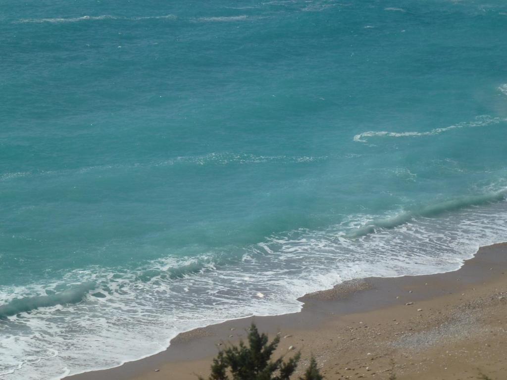 an aerial view of the ocean and the beach at Apartments Juraj in Drasnice