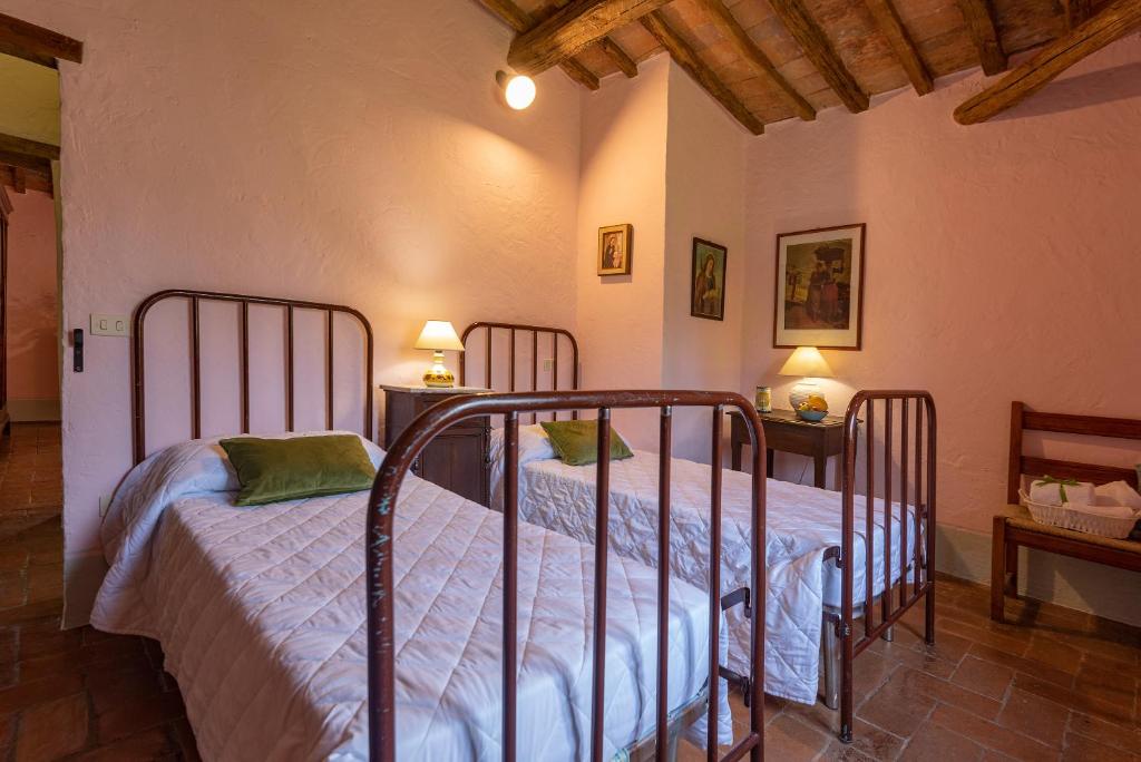 Postel nebo postele na pokoji v ubytování Podere Colombaio - Verbena