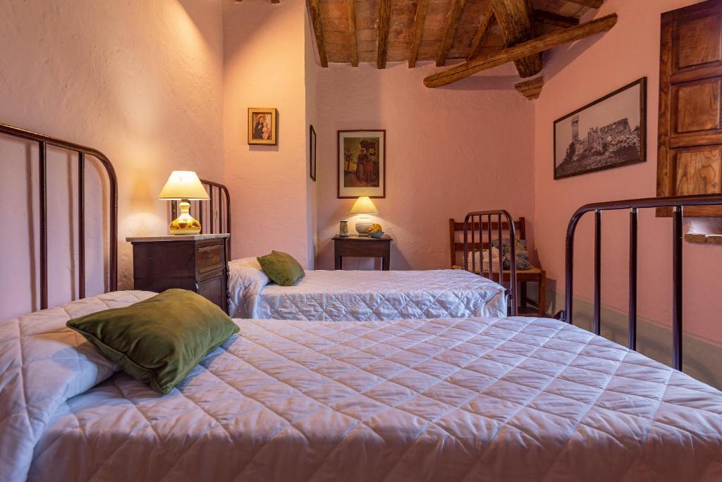 Postel nebo postele na pokoji v ubytování Podere Colombaio - Verbena