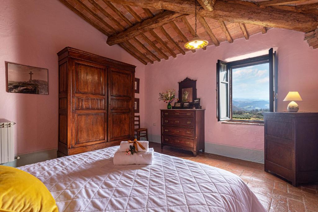Postel nebo postele na pokoji v ubytování Podere Colombaio - Verbena