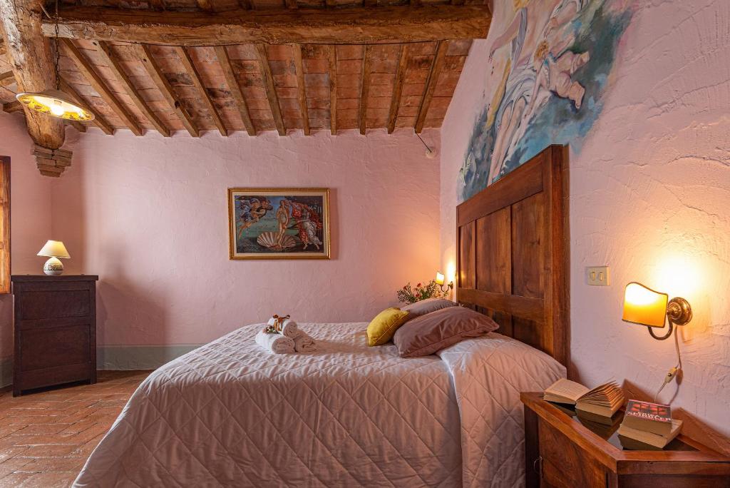 Postel nebo postele na pokoji v ubytování Podere Colombaio - Verbena