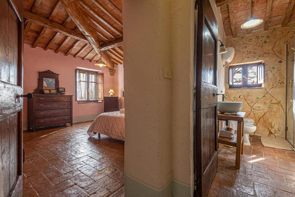 Postel nebo postele na pokoji v ubytování Podere Colombaio - Verbena