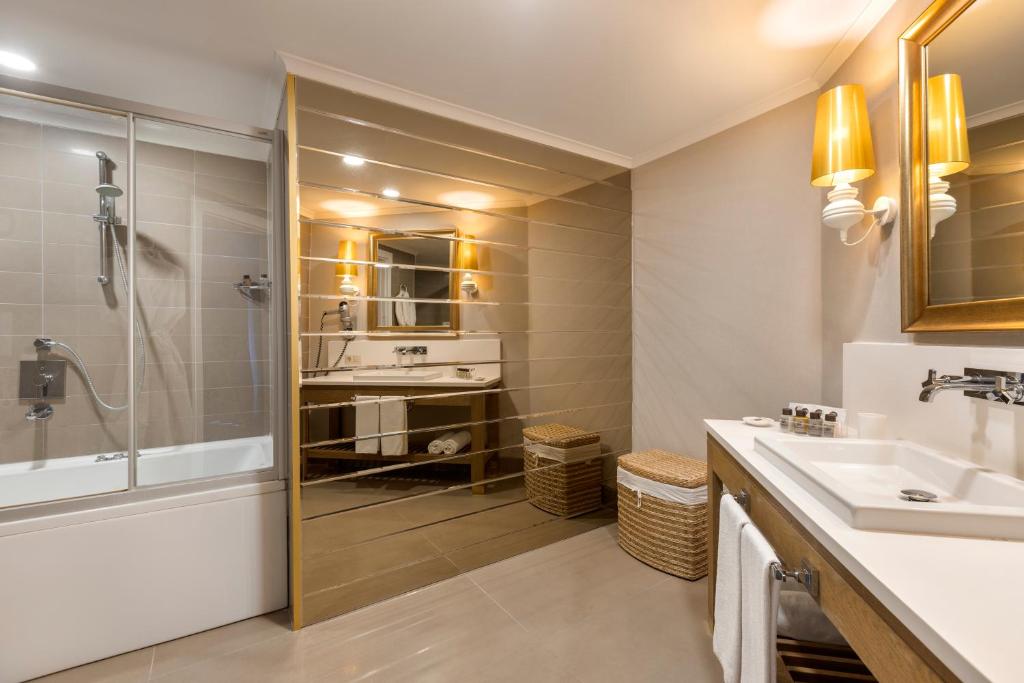 a bathroom with a shower and a sink at Limak Arcadia Sport Resort Belek in Belek