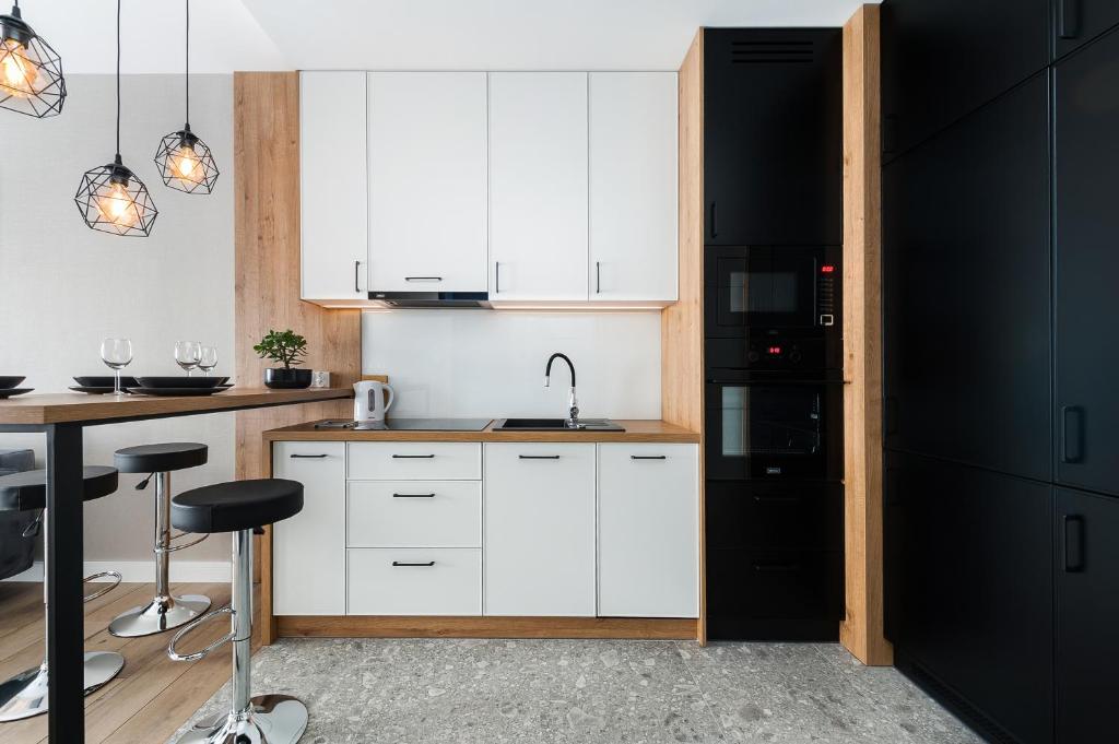 Kuchyňa alebo kuchynka v ubytovaní Krakowiak Apartment