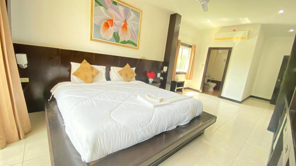 Postel nebo postele na pokoji v ubytování SM Patong Resort