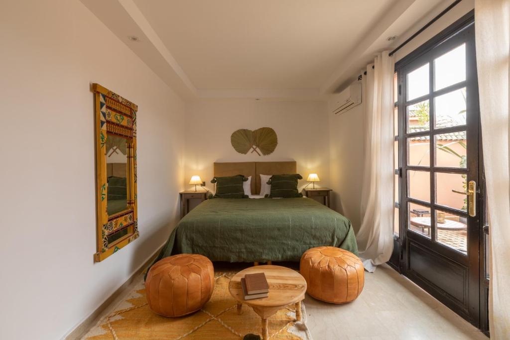 Postel nebo postele na pokoji v ubytování Riad Ksar Saad & Spa