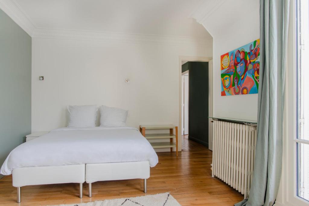 Posteľ alebo postele v izbe v ubytovaní Courcelles Design Duplex