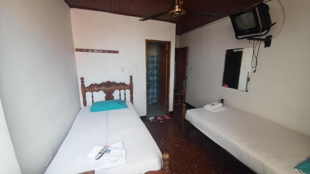 Postel nebo postele na pokoji v ubytování HOTEL en MONTERIA CITY