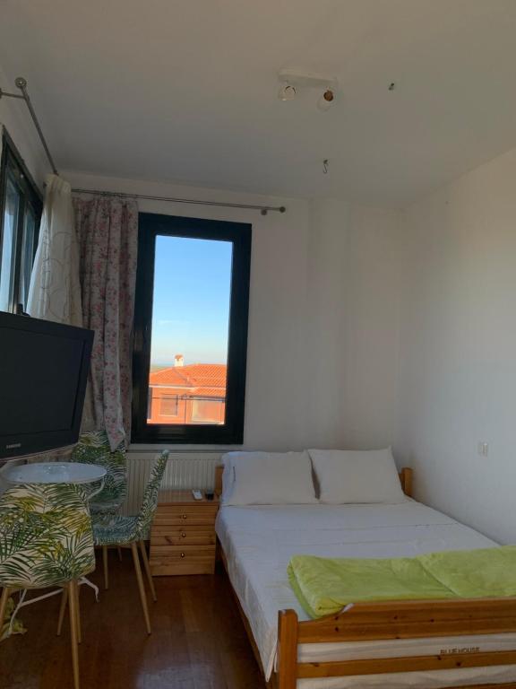 Postel nebo postele na pokoji v ubytování BLUE HOUSE
