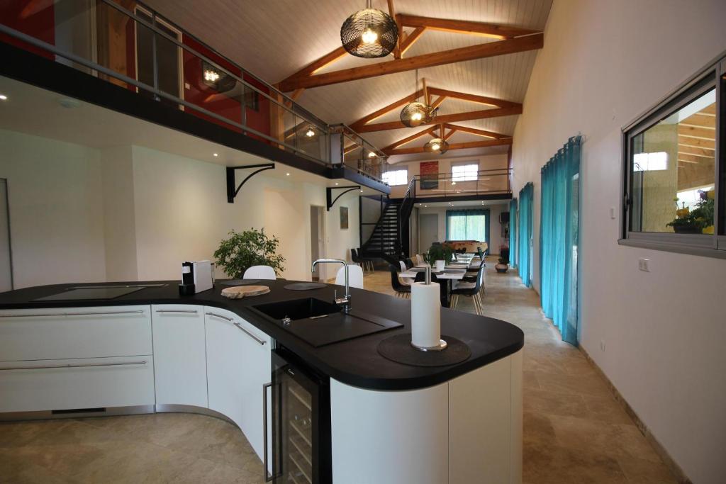 a kitchen with a sink and a counter top at Gite de L'Enclos in Lavardens