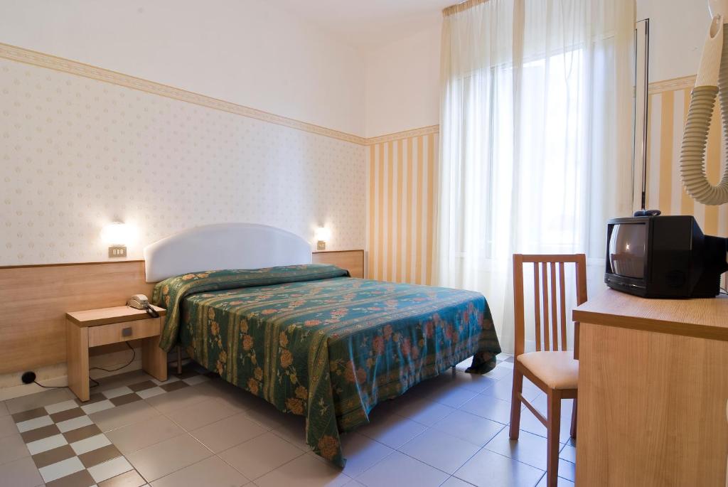 Postel nebo postele na pokoji v ubytování Hotel Loris - Valentini Family Village