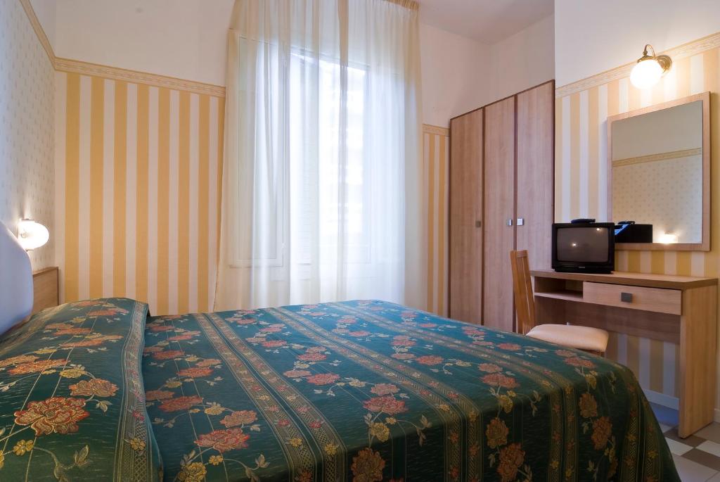 Postel nebo postele na pokoji v ubytování Hotel Loris - Valentini Family Village
