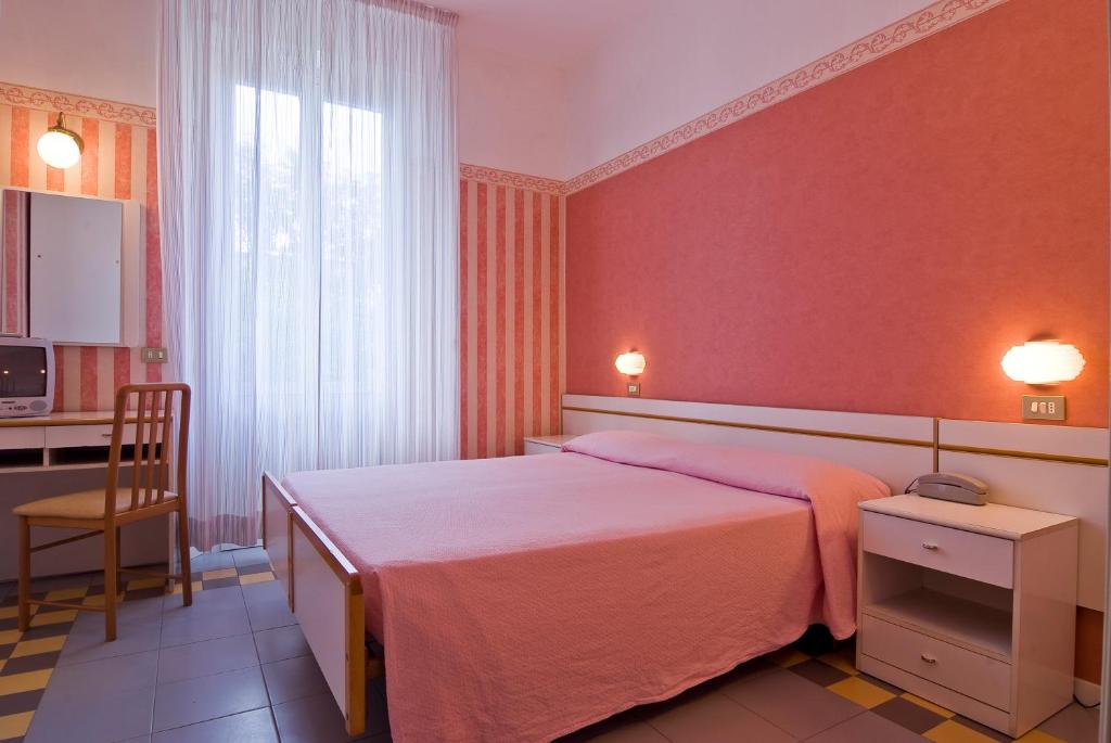 Postel nebo postele na pokoji v ubytování Hotel Loris - Valentini Family Village
