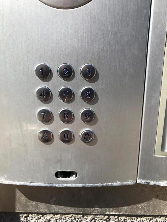 a bunch of buttons on a metal machine at 12 Torvegade. 1 door 4. (id.154) in Esbjerg