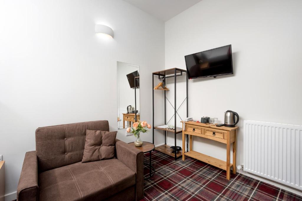 TV a/nebo společenská místnost v ubytování SMITH PLACE HOTEL