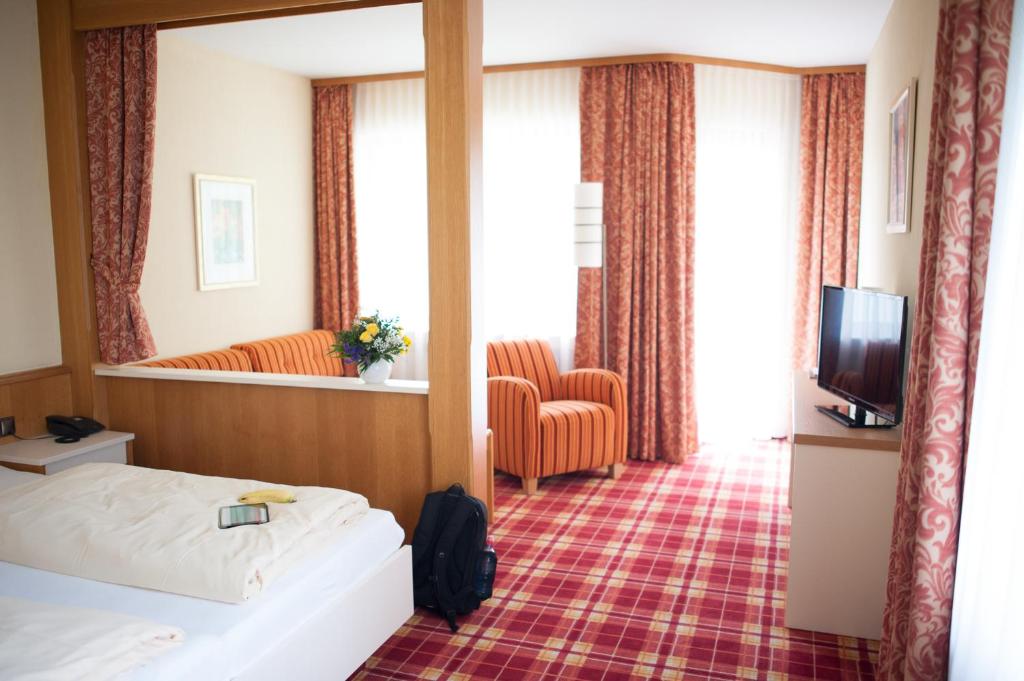 Postel nebo postele na pokoji v ubytování Hotel Berghof