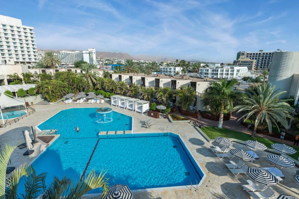 an overhead view of a swimming pool in a resort at Riviera by Isrotel Collection in Eilat