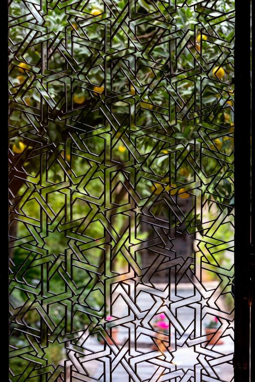 a close up of a stained glass window at Hospes Palacio del Bailio, a Member of Design Hotels in Córdoba