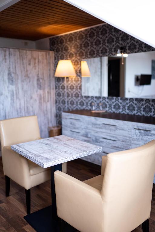 Posezení v ubytování Hotel Harlesiel