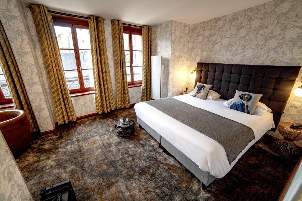 Postel nebo postele na pokoji v ubytování Logis Hôtel & Restaurant - Les Hauts de Montreuil