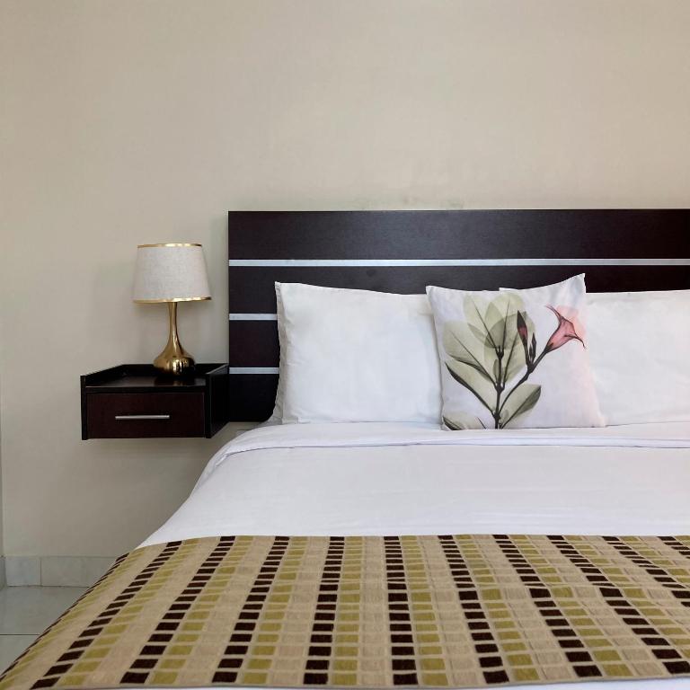 Postel nebo postele na pokoji v ubytování Hotel Ceibo Dorado