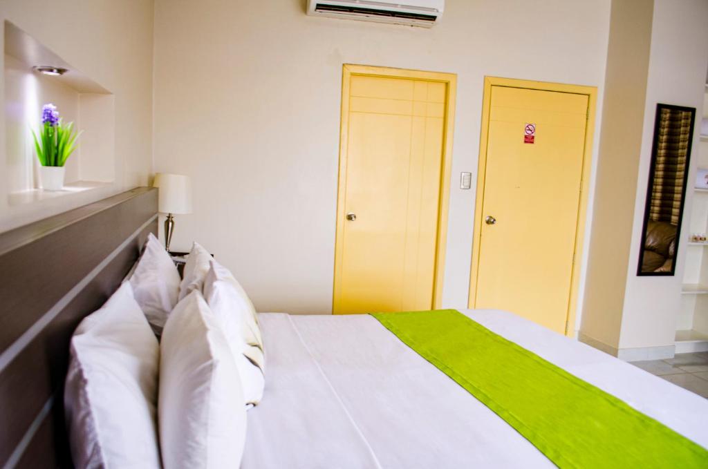 Postel nebo postele na pokoji v ubytování Hotel Ceibo Dorado