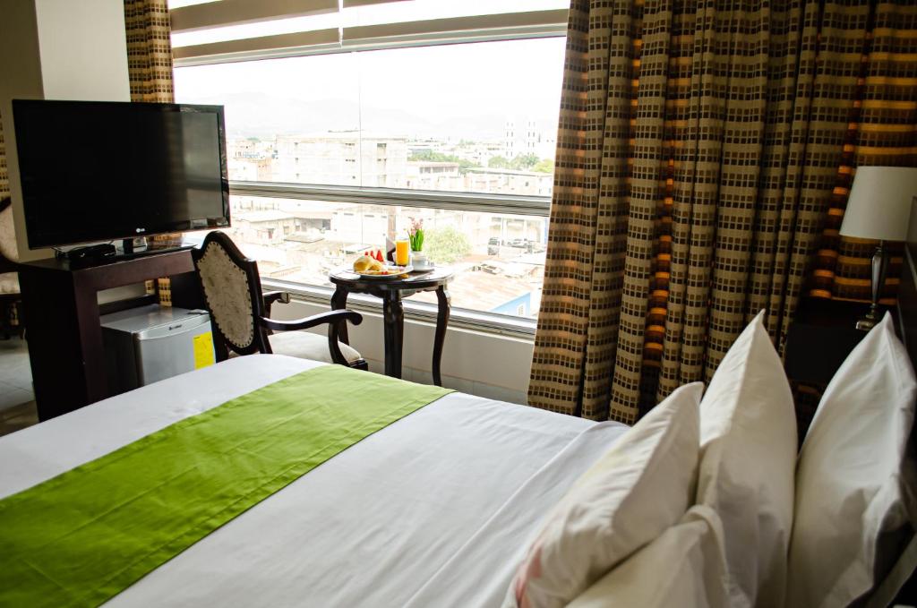 Postel nebo postele na pokoji v ubytování Hotel Ceibo Dorado