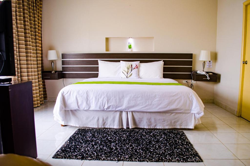 Postel nebo postele na pokoji v ubytování Hotel Ceibo Dorado