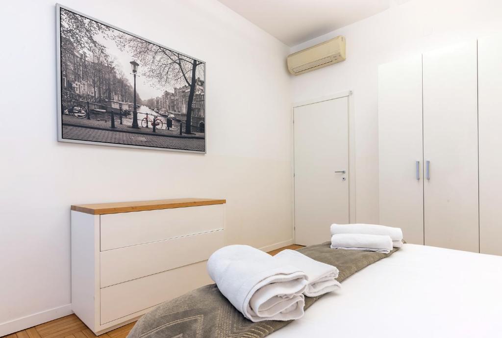Кровать или кровати в номере Milan Retreats