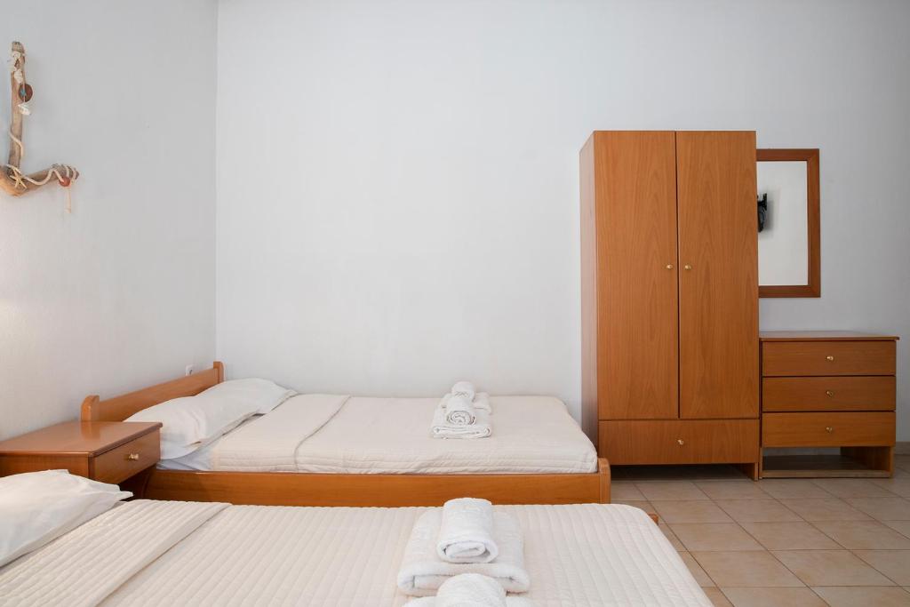 Postel nebo postele na pokoji v ubytování Gravanis Studios
