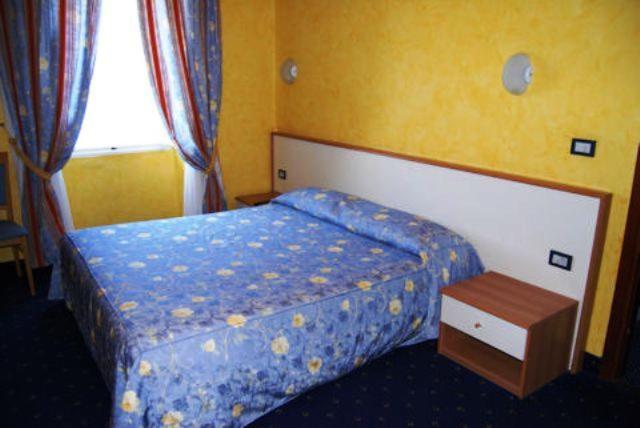 Postel nebo postele na pokoji v ubytování Hotel Beata Giovannina